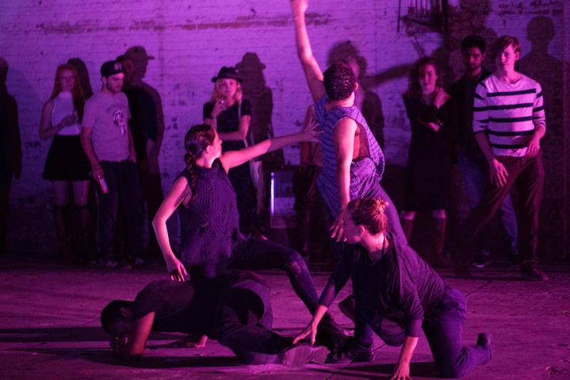 Four women executing spindly gestures in a tablau